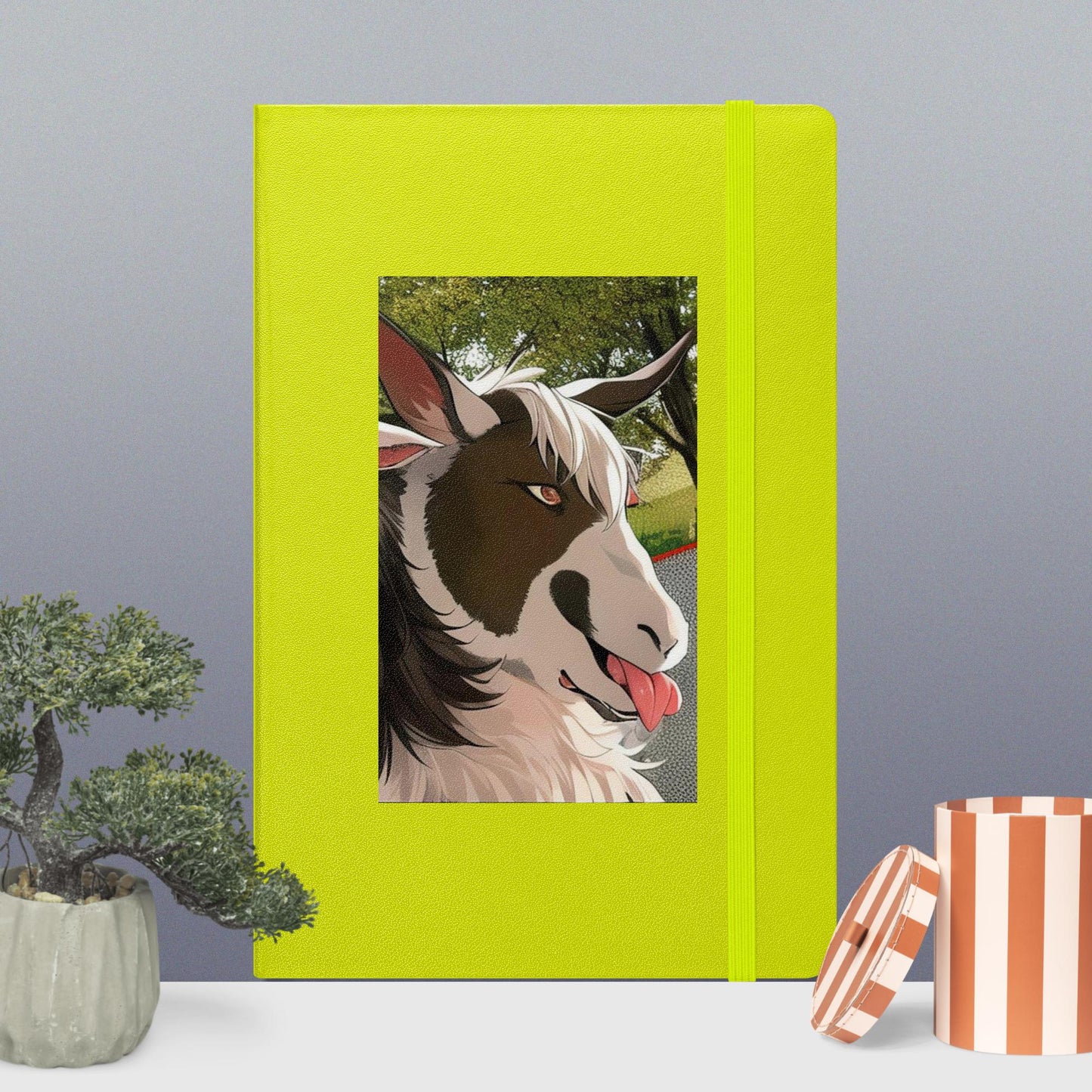 Hardcover bound notebook with goat cartoon with tongue out