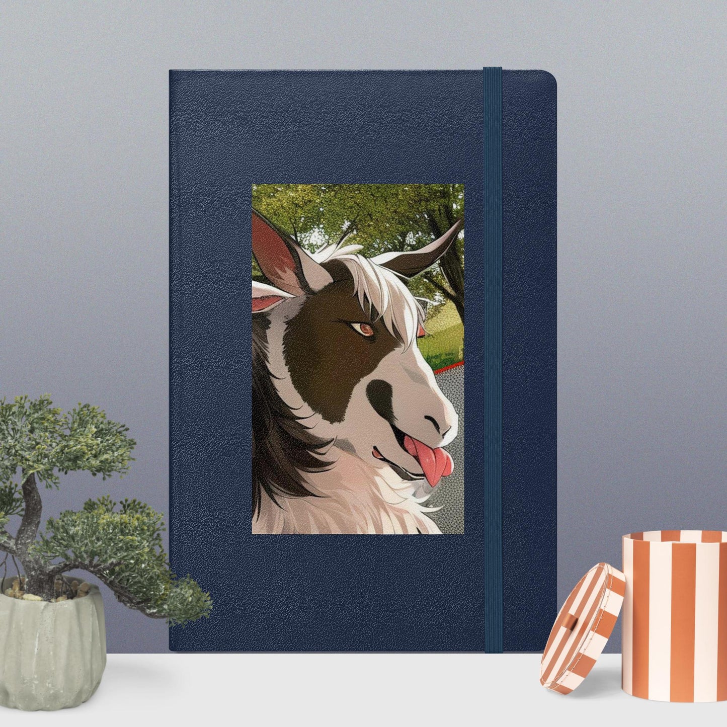Hardcover bound notebook with goat cartoon with tongue out