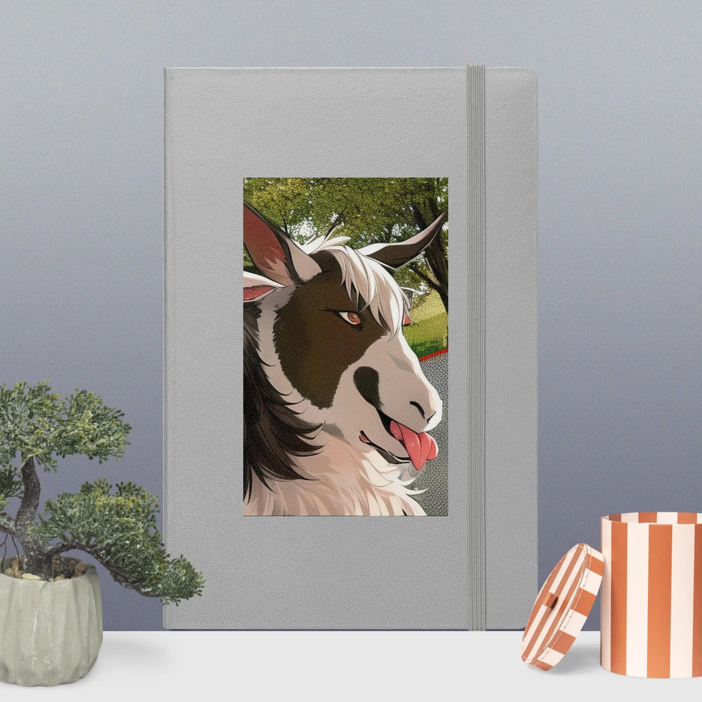 Hardcover bound notebook with goat cartoon with tongue out